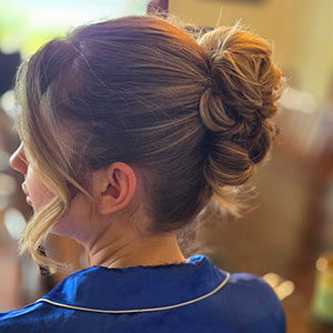 Elegant bridal hair updo styled at Kaila’s Trend and Trim Salon on Whidbey Island, perfect for island weddings.