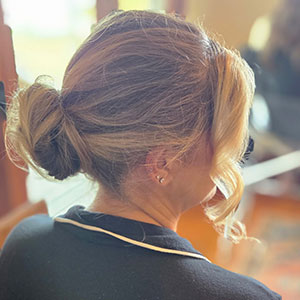 Elegant bridal hair updo styled at Kaila’s Trend and Trim Salon on Whidbey Island, perfect for island weddings.